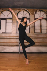 Model wearing the Attitude Jumpsuit, showcasing elegant design and silhouette in a stylish pose.