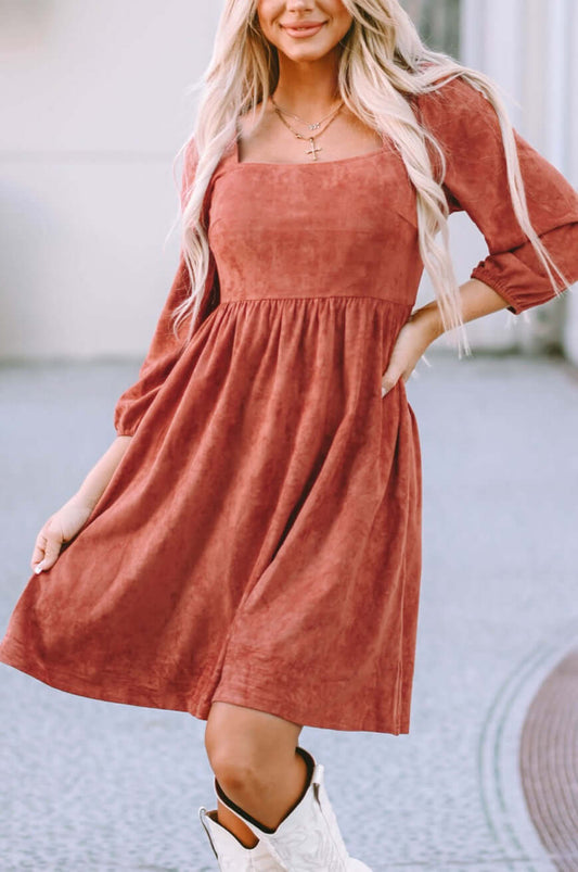 Kaylee suede square neck puff sleeve dress in rust color, featuring puff sleeves and a flared skirt.