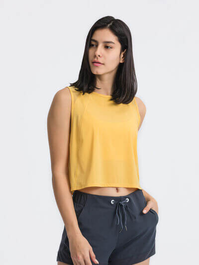 Millennia Round Neck Cropped Active Tank in yellow, featuring a basic style and highly stretchy fabric.