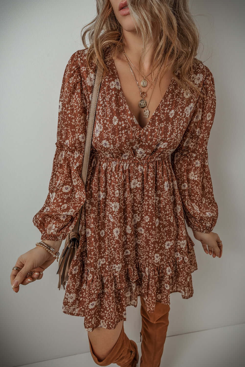 Ashley Boho Floral Puff Sleeve Mini Dress with V-neckline and ruffles, perfect for a feminine, bohemian style.