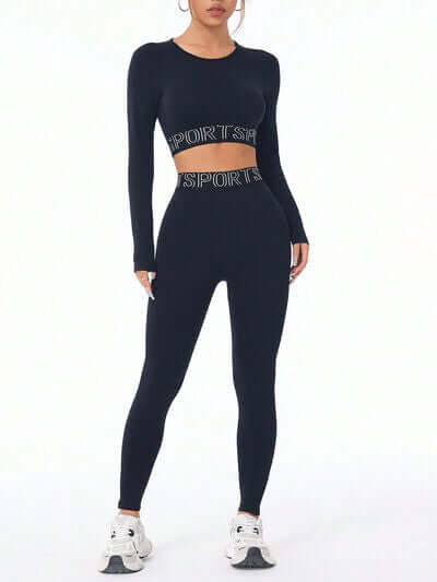 Model wearing a black letter print round neck long sleeve top and leggings active set, perfect for workouts.