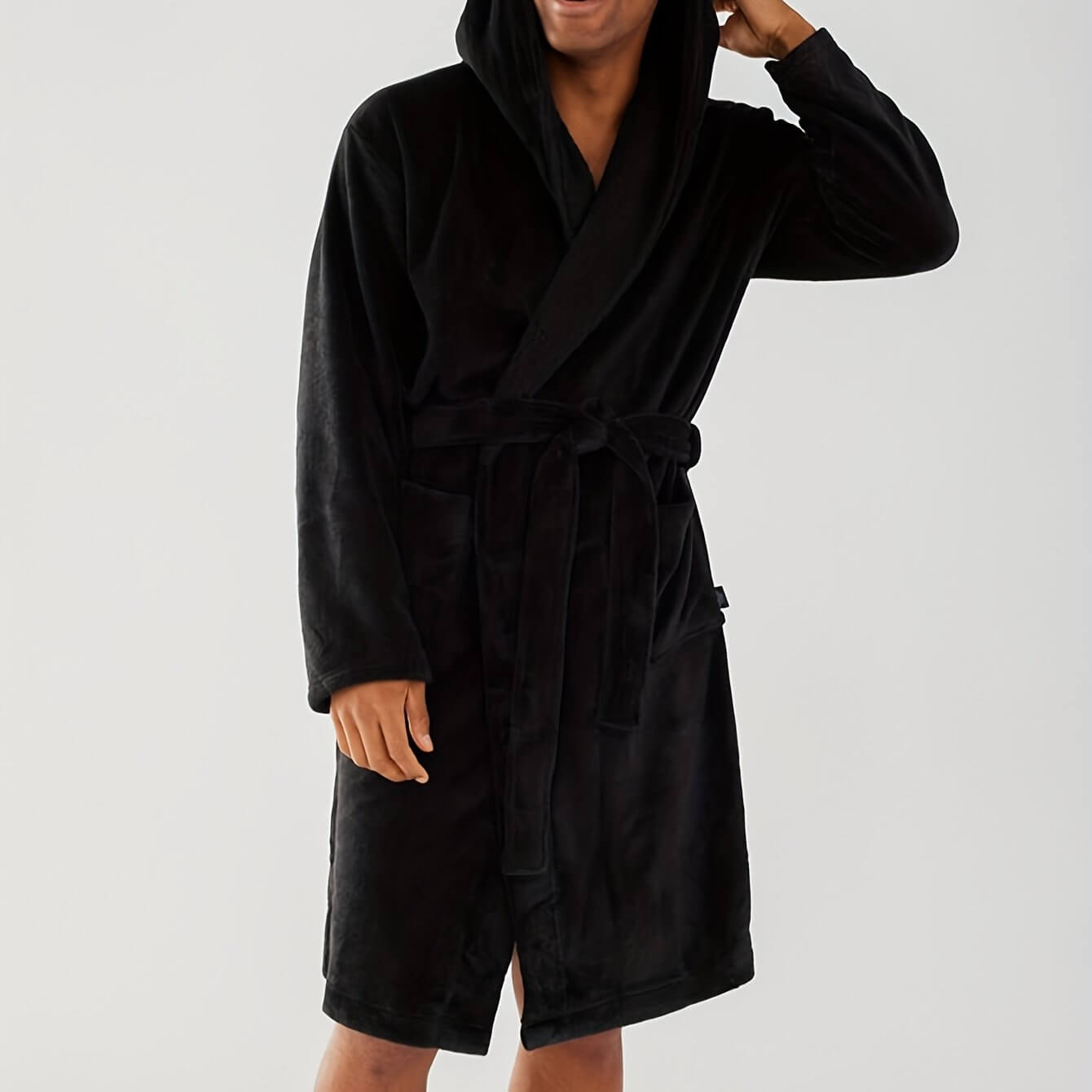 Men's cozy black hooded robe made from soft coral fleece for ultimate comfort and style in lounge wear.