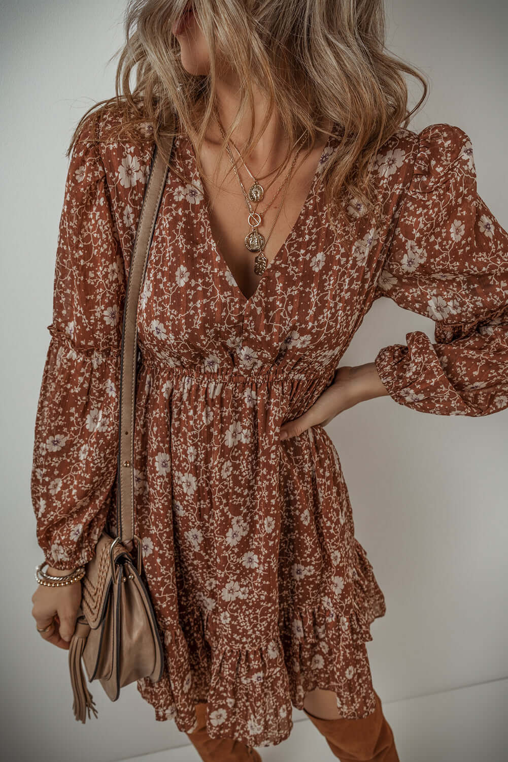 Ashley Boho Floral Puff Sleeve Mini Dress with ruffles and V-neckline in warm brown floral pattern.