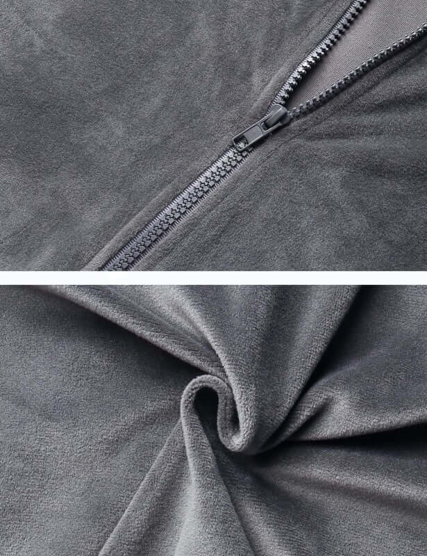 Close-up of soft gray fleece fabric and zipper detail, showcasing high-quality materials for cozy apparel.