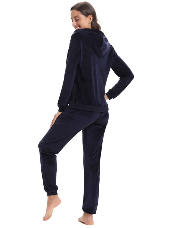 Back view of a woman wearing a navy blue cozy knit two-piece set, perfect for autumn and winter leisure wear.