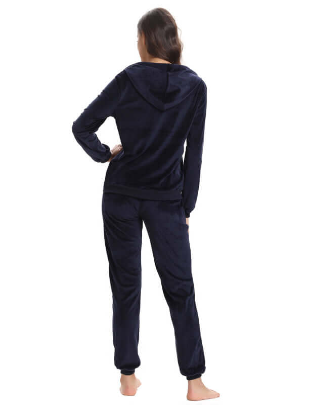 Back view of a woman wearing a cozy navy knit two-piece set, perfect for leisure in autumn and winter.