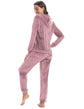 Woman wearing a cozy knit two-piece set in soft pink, featuring a hooded jacket and relaxed-fit pants, perfect for leisure.