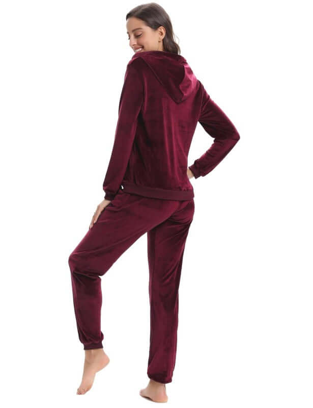 Back view of a woman in a cozy burgundy knit two-piece set, perfect for autumn-winter leisurewear.