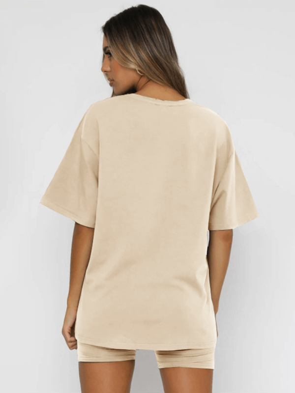 Back view of a women's solid color casual short-sleeved top and shorts two-piece set in beige.