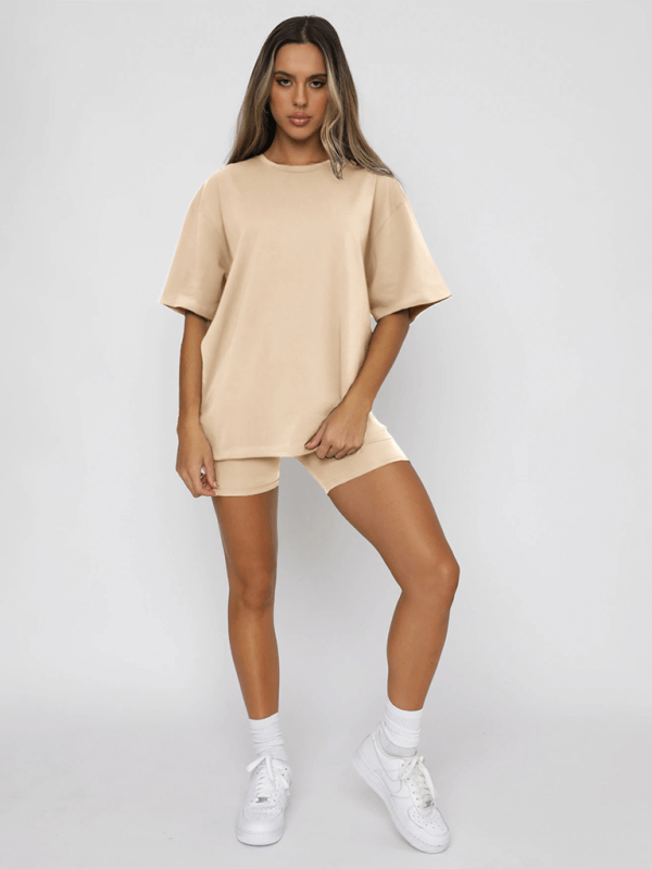 Women's solid color casual short-sleeved top and shorts two-piece set in beige, perfect for spring-summer leisure wear.