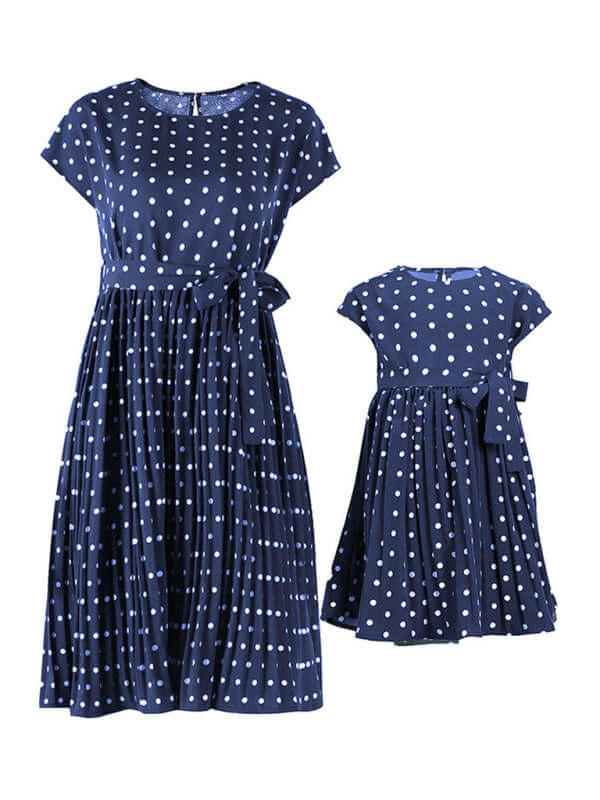 Women's woven polka dot pleated midi dress in navy blue with half sleeves and a high waist design.