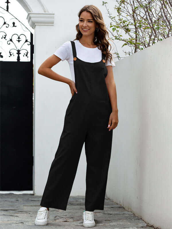 Model wearing women's woven retro casual long overalls in black with slant pockets and square collar.