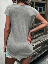 Back view of a woman in a grey short sleeve t-shirt, showcasing a casual and comfortable style.