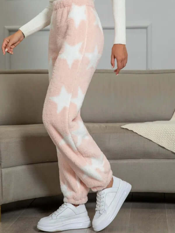 New coral fleece pajamas in pink with white stars, perfect for autumn-winter, styled with white sneakers.