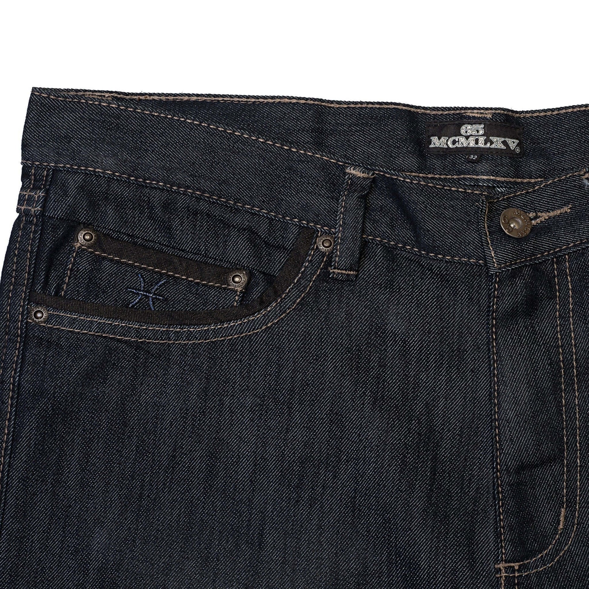 Close-up of 65 McMlxv men's premium denim dark wash jean featuring logo and straight-leg design.