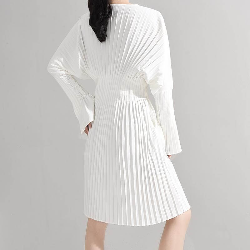 Sakiya pleated long sleeve shirt dress in white, featuring a knee-length design and elegant v-neck collar.