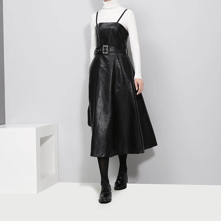 Musset Vegan Leather Dress in black, knee-length A-line silhouette, spaghetti strap, sleeveless with O-neck and natural waistline.