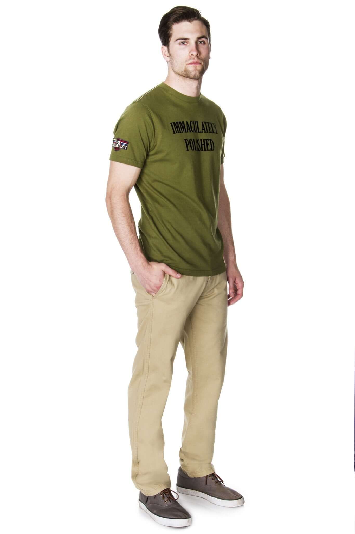 Man wearing khaki chino pants and an olive green t-shirt, showcasing a stylish casual look.