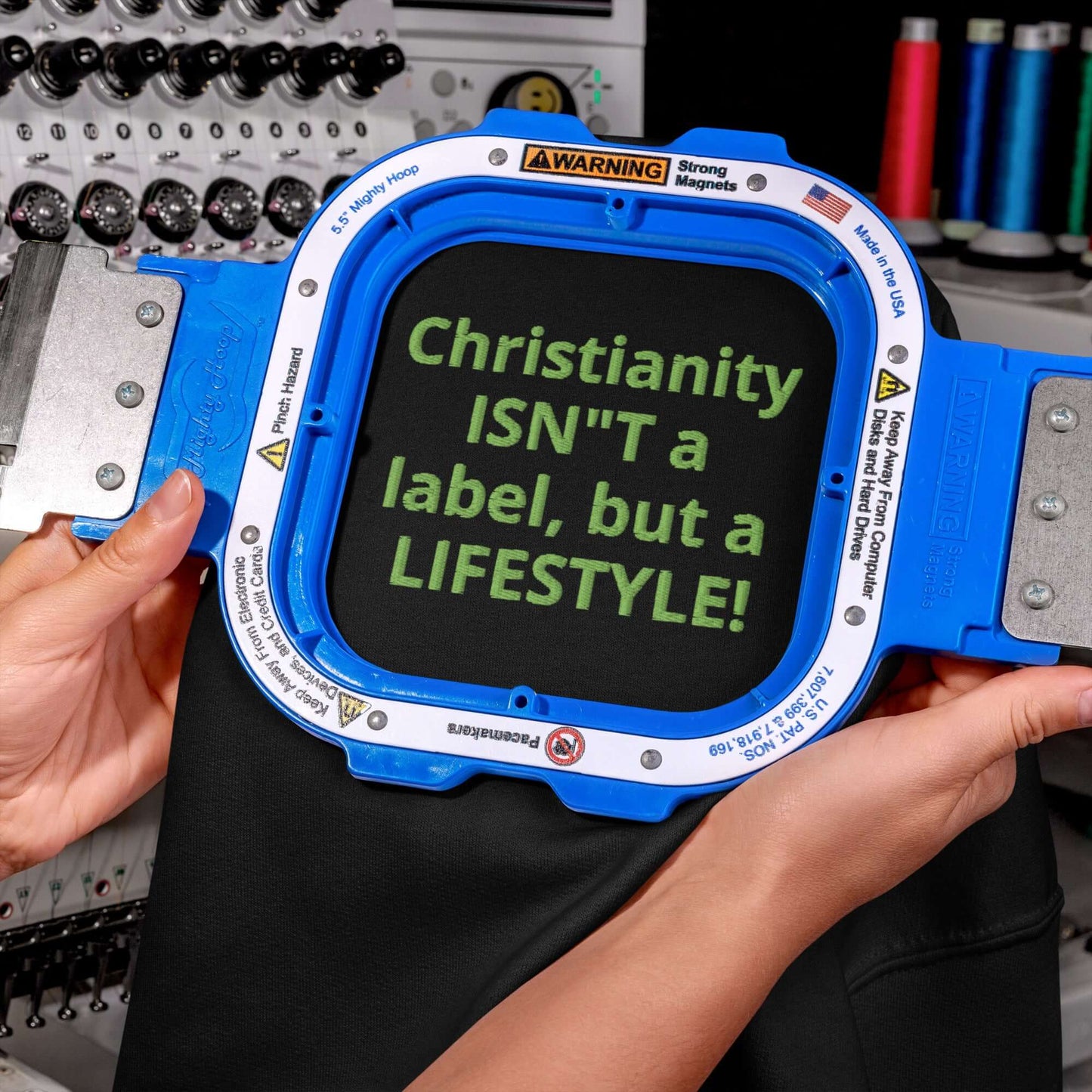 Embroidered embroidery hoop displaying 'Christianity ISN'T a label, but a LIFESTYLE!' on unisex hoodie.